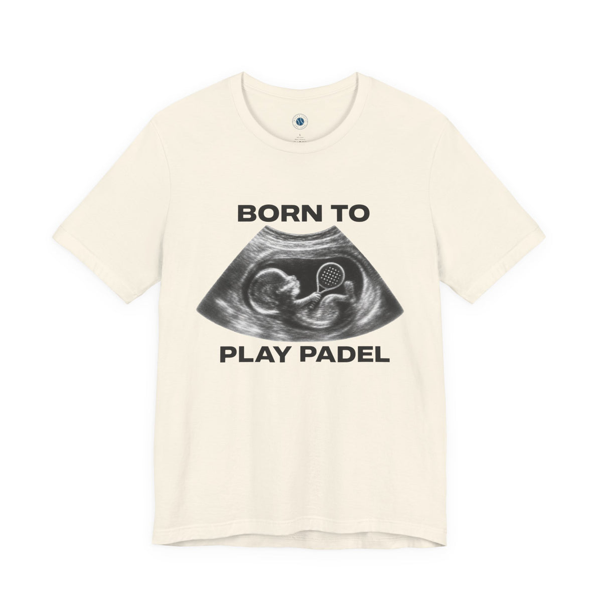 An off-white short-sleeve t-shirt with a black graphic of an ultrasound showing a fetus and the text 'BORN TO PLAY PADEL' printed on the front.